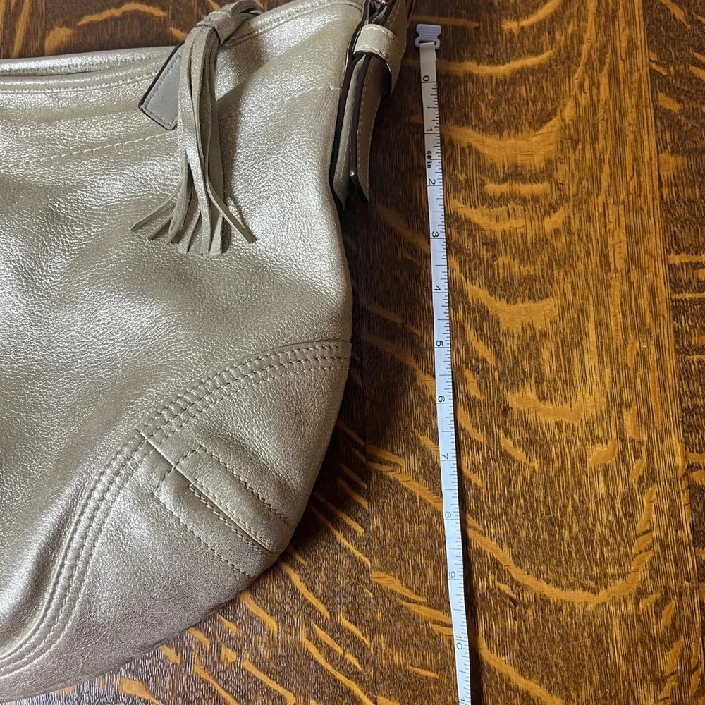 Coach Gold GOAT Leather Hobo Bag with gold tassel